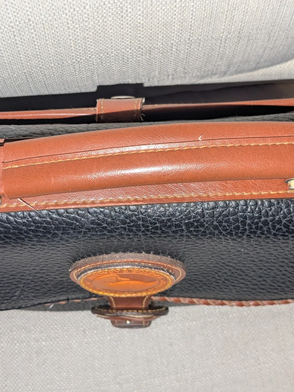 Dooney & Bourke Black Pebbled Leather Briefcase with Brown Trim
